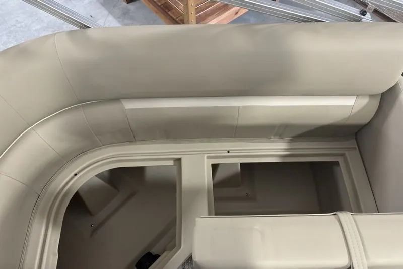 Slide: The Image of Interior seating of 2027 Godfrey XPERIENCE 2086 pontoon boat, featuring beige upholstery. - 24