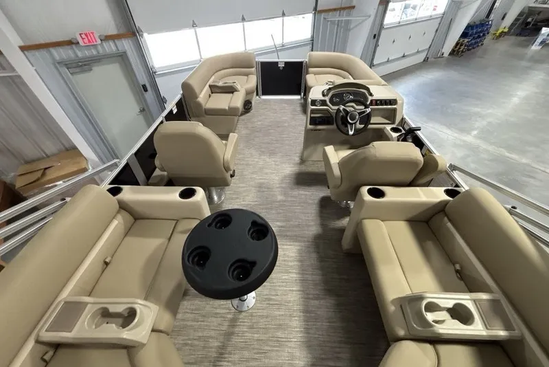 Slide: The Image of Interior of 2027 Godfrey XPERIENCE 2086 pontoon boat with beige seating and steering console. - 16