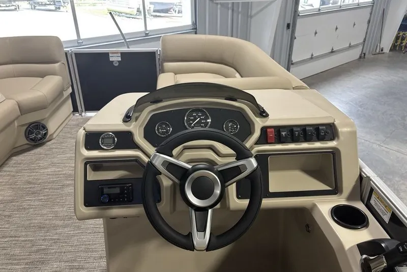 Slide: The Image of Interior view of 2027 Godfrey XPERIENCE 2086 boat dashboard with steering wheel and controls. - 9