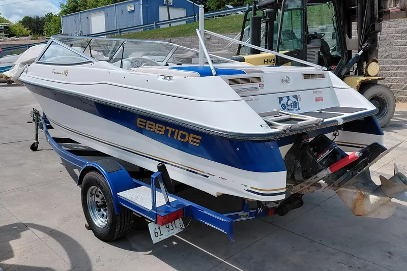 Slide: The Image of 1999 Ebbtide Campione 190 boat on trailer, parked outdoors. - 1