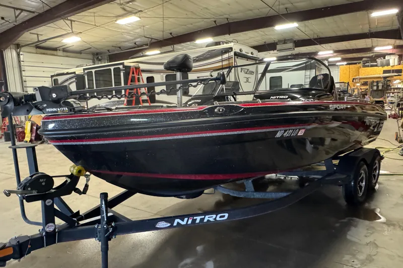 Slide: The Image of 2021 Nitro ZV19 Sport boat in a garage, mounted on a trailer. - 1