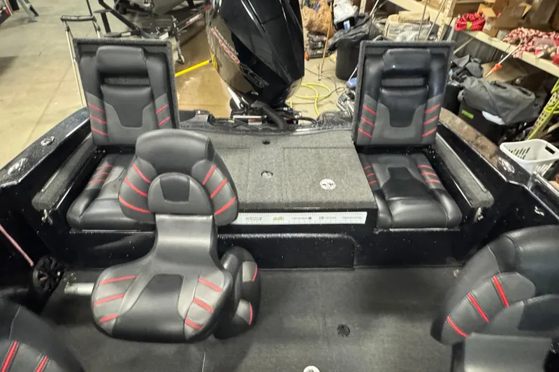 Slide: The Image of Interior of a 2021 Nitro ZV19 Sport boat with black and red seating. - 10