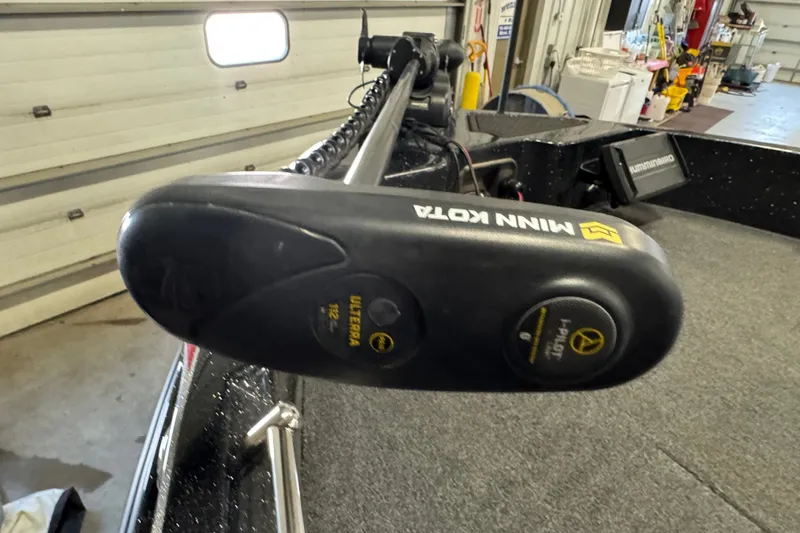 Slide: The Image of Minn Kota trolling motor on 2021 Nitro ZV19 Sport boat in a garage setting. - 16