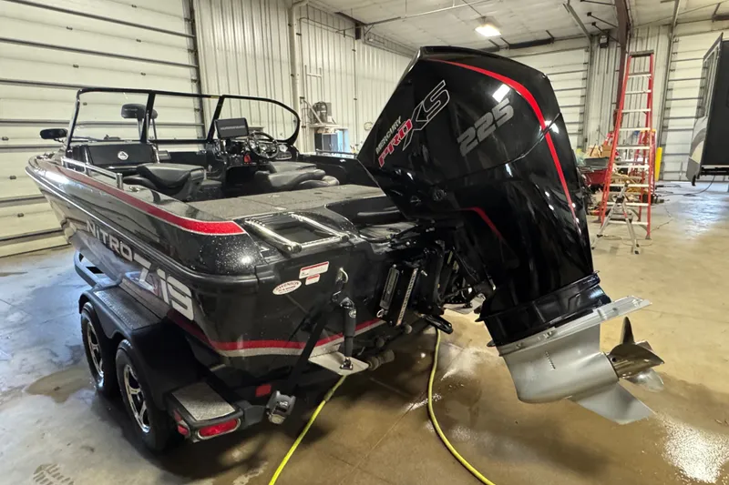 Slide: The Image of 2021 Nitro ZV19 Sport boat with Mercury Pro XS 225 engine in a garage. - 4