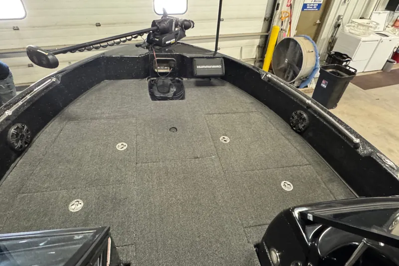Slide: The Image of 2021 Nitro ZV19 Sport boat interior with Humminbird electronics and trolling motor. - 13