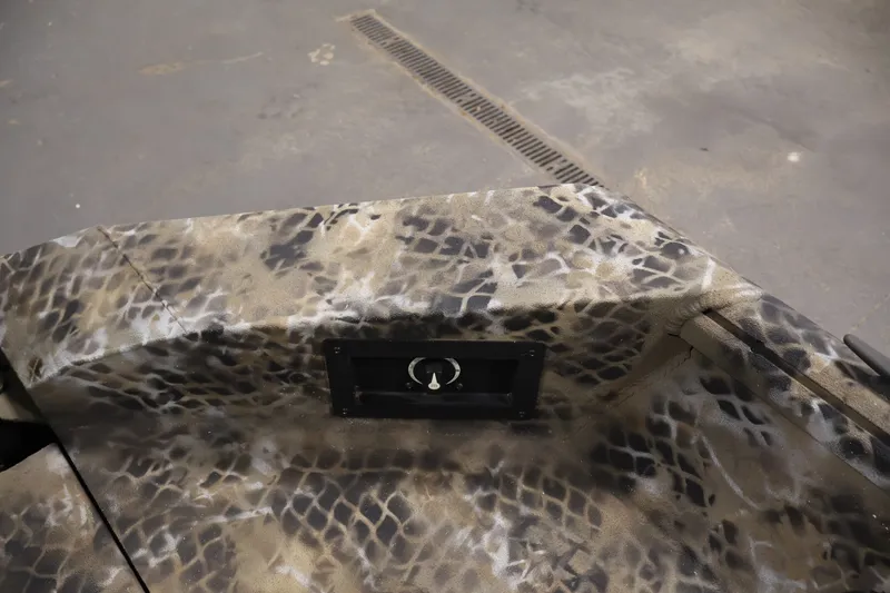 Slide: The Image of Camouflage-patterned interior of 2025 Excel 1651 River Warrior SC boat. - 22