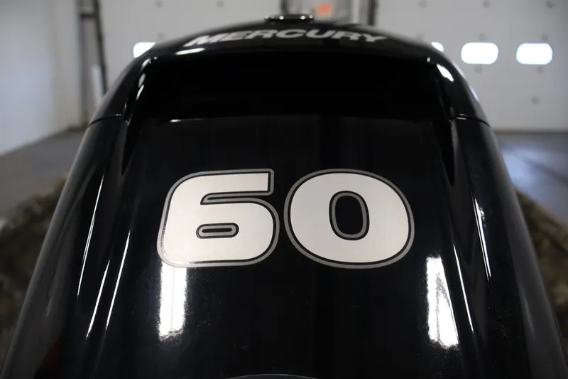 Slide: The Image of Close-up of a Mercury 60 horsepower outboard motor on a 2025 Excel 1651 River Warrior SC. - 25