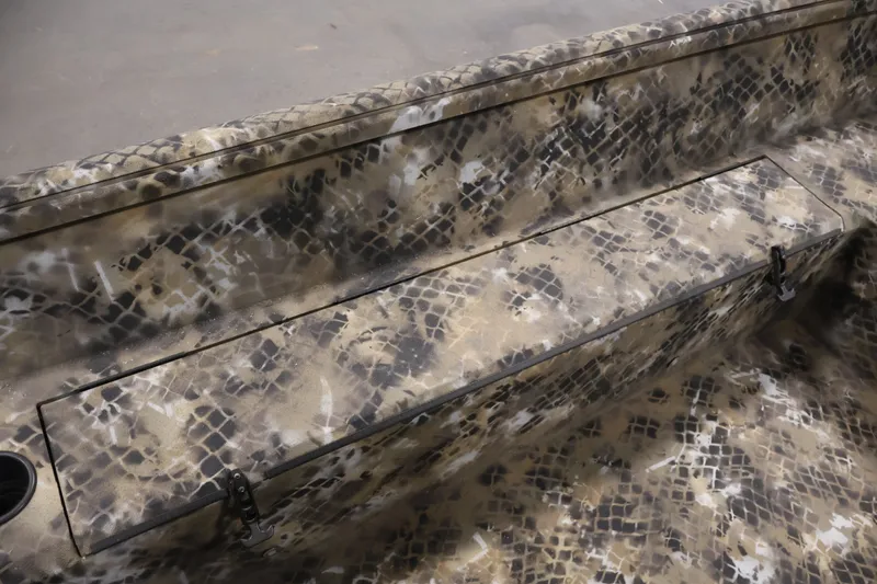 Slide: The Image of 2025 Excel 1651 River Warrior SC boat interior with camouflage pattern and storage compartment. - 20
