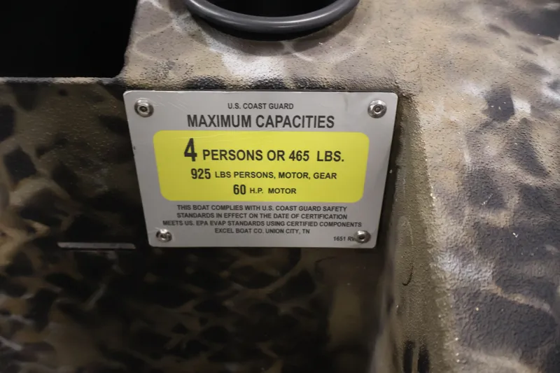Slide: The Image of 2025 Excel 1651 River Warrior SC capacity plate, 4 persons, 925 lbs, 60 HP motor. - 18