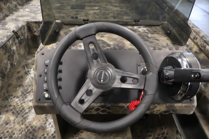 Slide: The Image of Steering console of 2025 Excel 1651 River Warrior SC boat with camouflage design. - 16