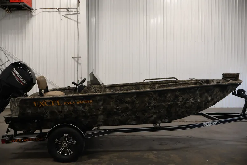 Slide: The Image of 2025 Excel 1651 River Warrior SC boat on trailer, camo design, Mercury engine. - 4