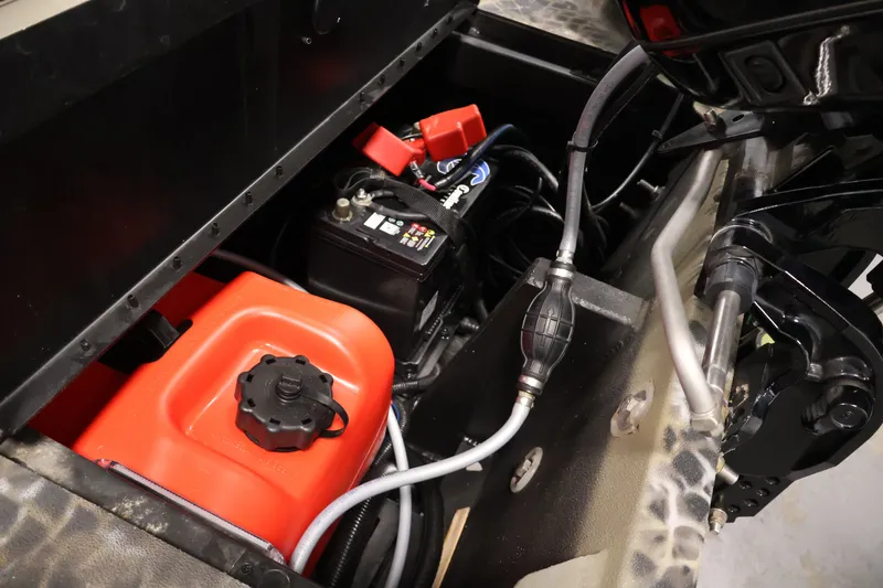 Slide: The Image of Battery and fuel tank setup in 2025 Excel 1651 River Warrior SC boat. - 23