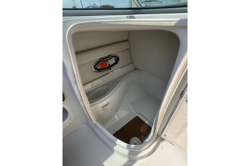 Slide: The Image of 2023 Crownline 250 XSS boat interior cabin with sleek design and modern amenities. - 5