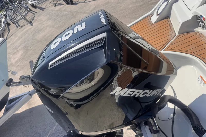 Slide: The Image of 2023 Crownline 250 XSS boat with Mercury 300 outboard engine, featuring teak-style decking. - 12