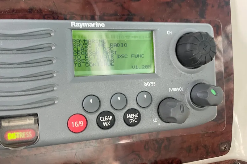 Slide: The Image of Raymarine radio control panel on 1999 Sea Ray 370 Express Cruiser. - 13
