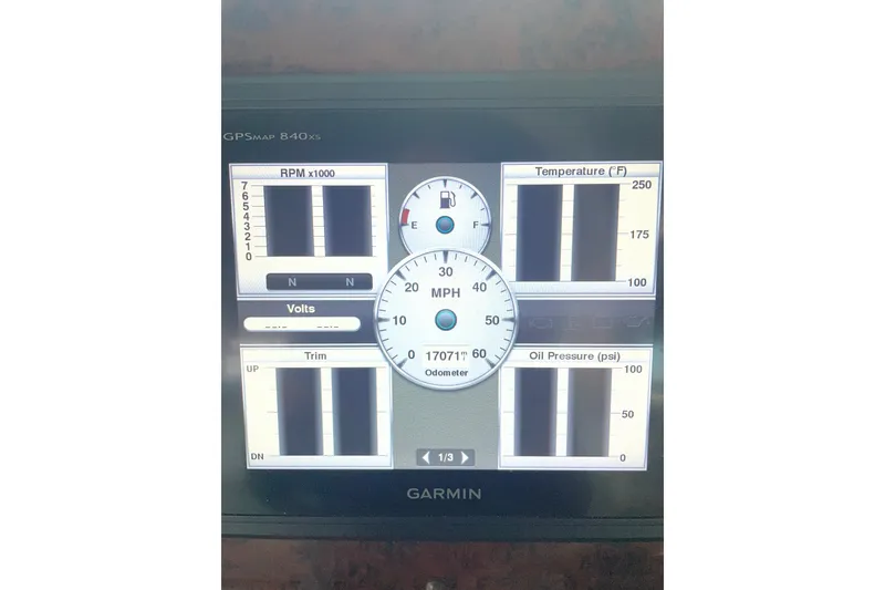 Slide: The Image of Garmin GPS display on 1999 Sea Ray 370 Express Cruiser showing RPM, temperature, and oil pressure. - 14