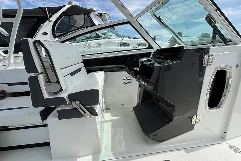 Slide: The Image of 2023 Blackfin 272 DC boat interior with modern seating and dashboard design. - 19