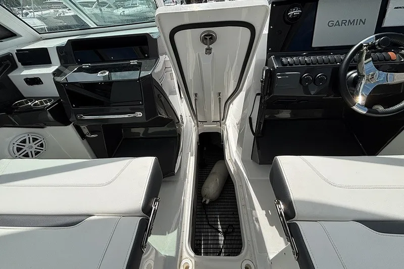Slide: The Image of 2023 Blackfin 272 DC boat interior with Garmin navigation and sleek seating. - 21