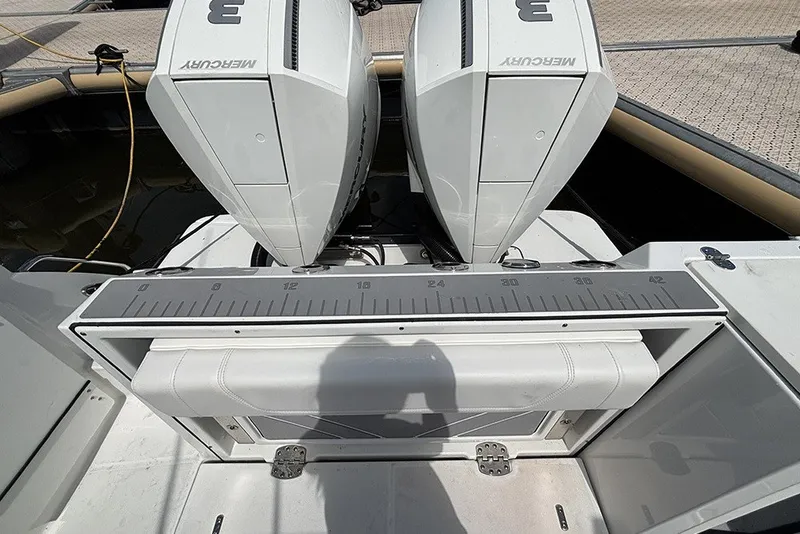 Slide: The Image of 2023 Blackfin 272 DC boat with dual Mercury engines and measuring board. - 10