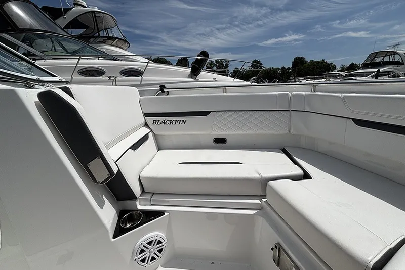 Slide: The Image of 2023 Blackfin 272 DC boat interior with white seating and sleek design. - 26