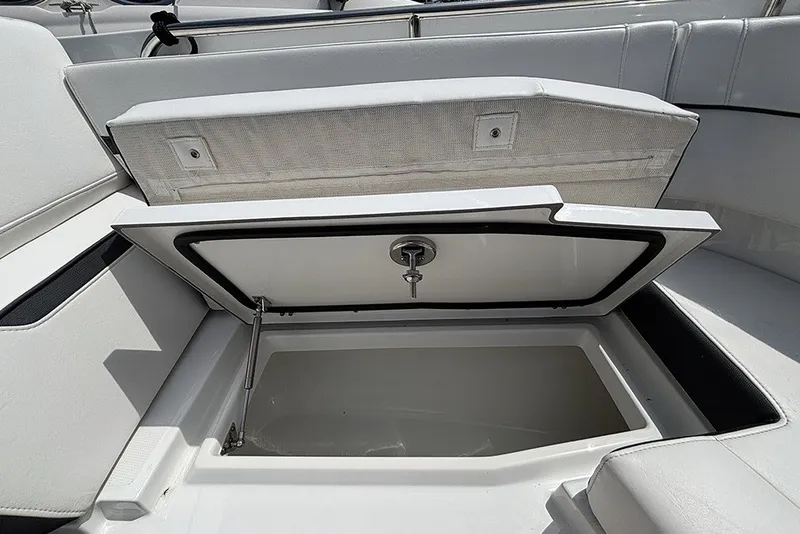 Slide: The Image of Open storage compartment on 2023 Blackfin 272 DC boat, showcasing spacious interior. - 27