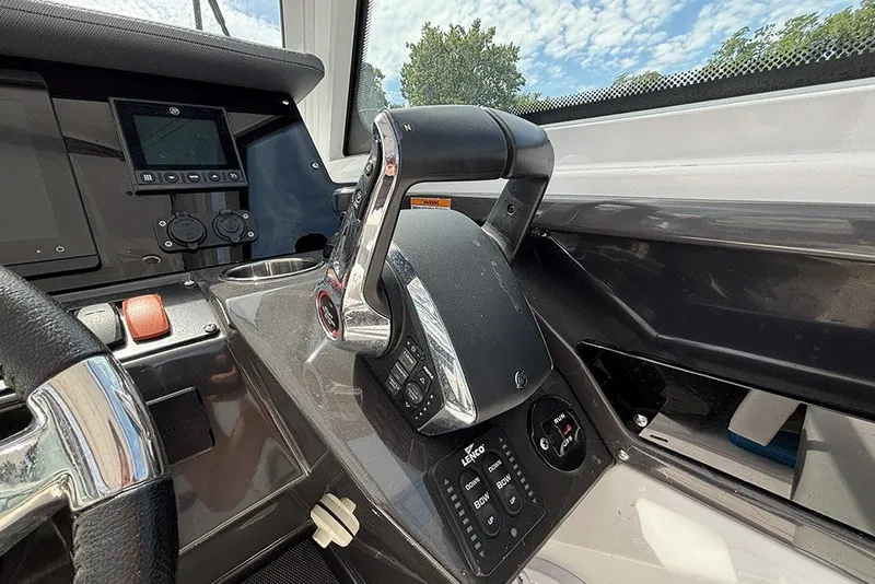 Slide: The Image of Control panel of 2023 Blackfin 272 DC boat with steering wheel and throttle. - 18