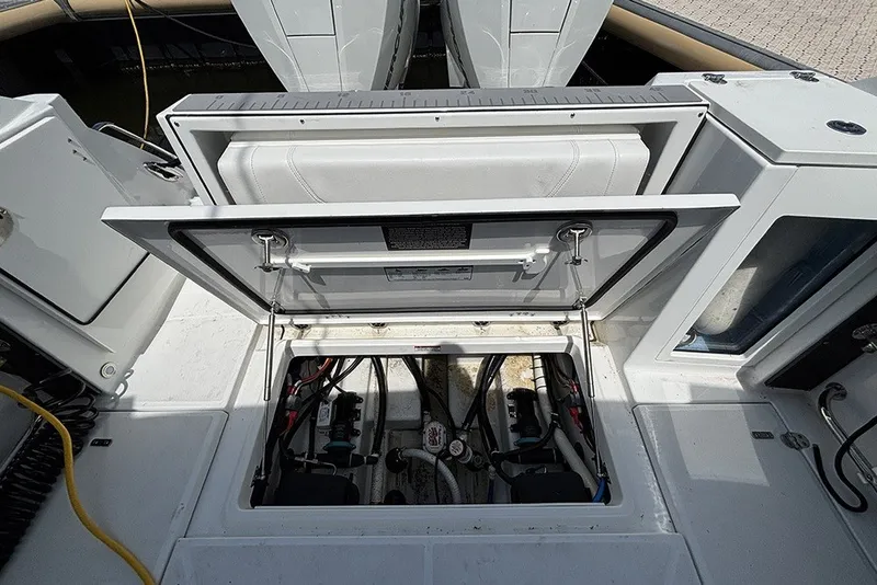 Slide: The Image of Open hatch revealing engine compartment of 2023 Blackfin 272 DC boat. - 31