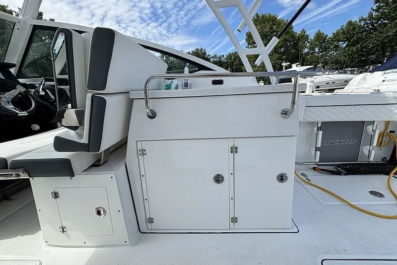 Slide: The Image of 2023 Blackfin 272 DC boat interior with seating and storage compartments. - 11