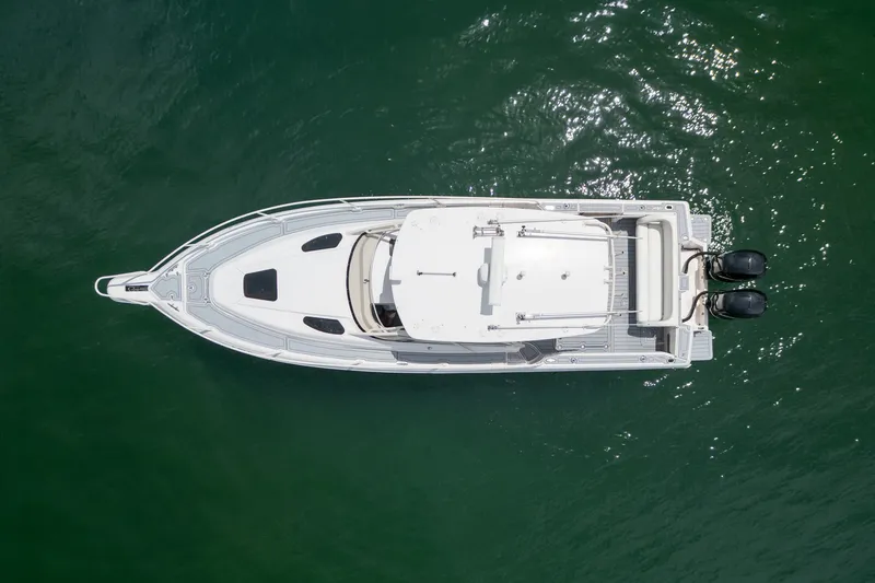 Slide: The Image of Aerial view of 2006 Intrepid 348 Walkaround boat on green water. - 10