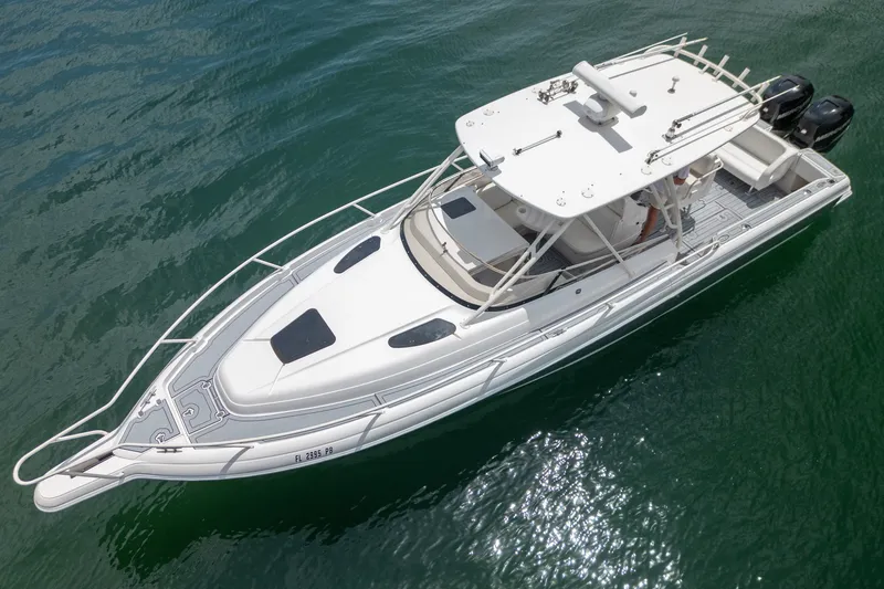 Slide: The Image of 2006 Intrepid 348 Walkaround boat on clear water, aerial view. - 17
