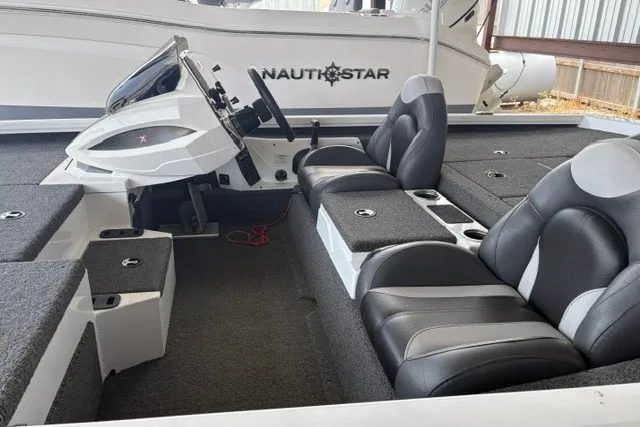 Slide: The Image of 2023 Vexus AVX1980 boat interior with sleek black and gray seating and modern dashboard. - 9