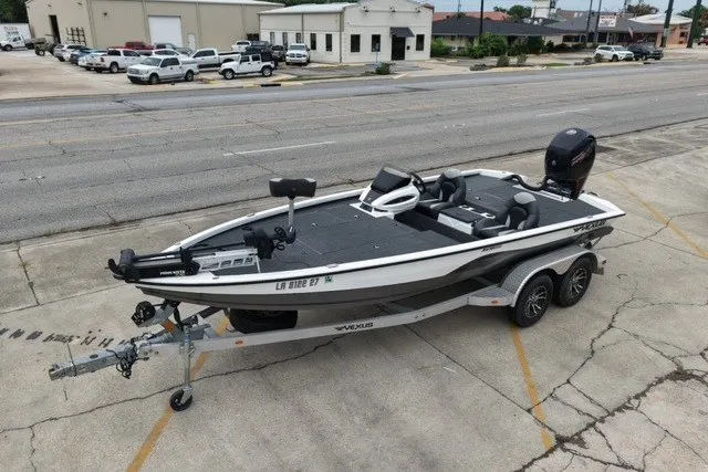 Slide: The Image of 2023 Vexus AVX1980 boat on trailer, parked in urban area, side view. - 11