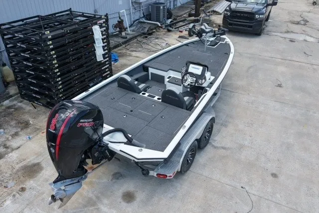 Slide: The Image of 2023 Vexus AVX1980 boat with Mercury Pro XS engine, parked on concrete. - 8