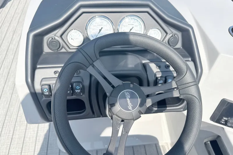 Slide: The Image of Steering wheel and dashboard of 2027 Bentley Pontoons Legacy 200 Navigator boat. - 12