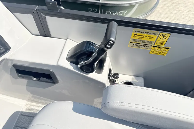 Slide: The Image of Control panel of 2027 Bentley Pontoons Legacy 200 Navigator with capacity warning label. - 10