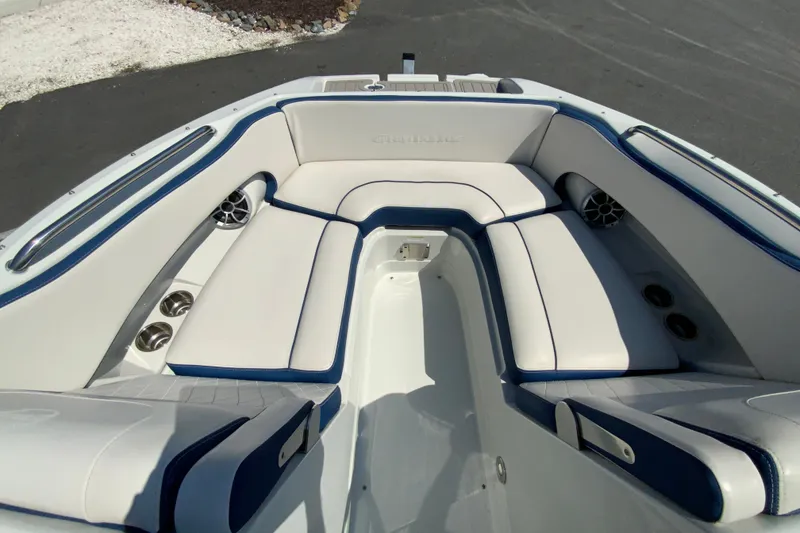 Slide: The Image of 2019 Crownline Eclipse E235 XS boat interior with white and blue seating. - 17