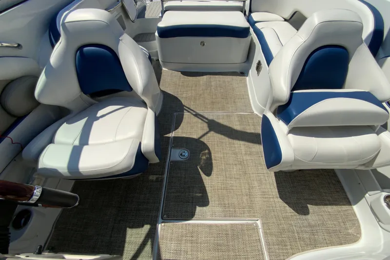 Slide: The Image of 2019 Crownline Eclipse E235 XS boat interior with white and blue seating. - 29