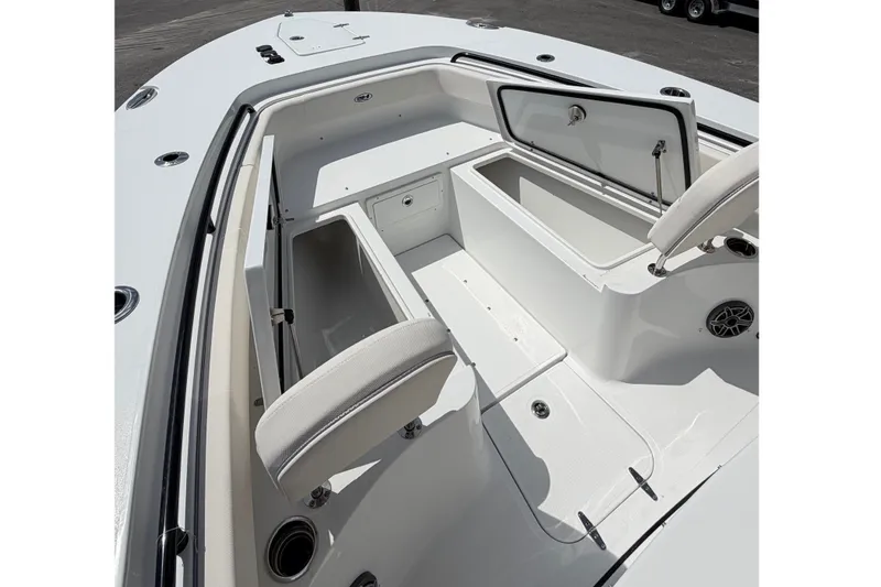 Slide: The Image of 2027 Sea Hunt Gamefish 25 boat interior with open storage compartments under a cloudy sky. - 21