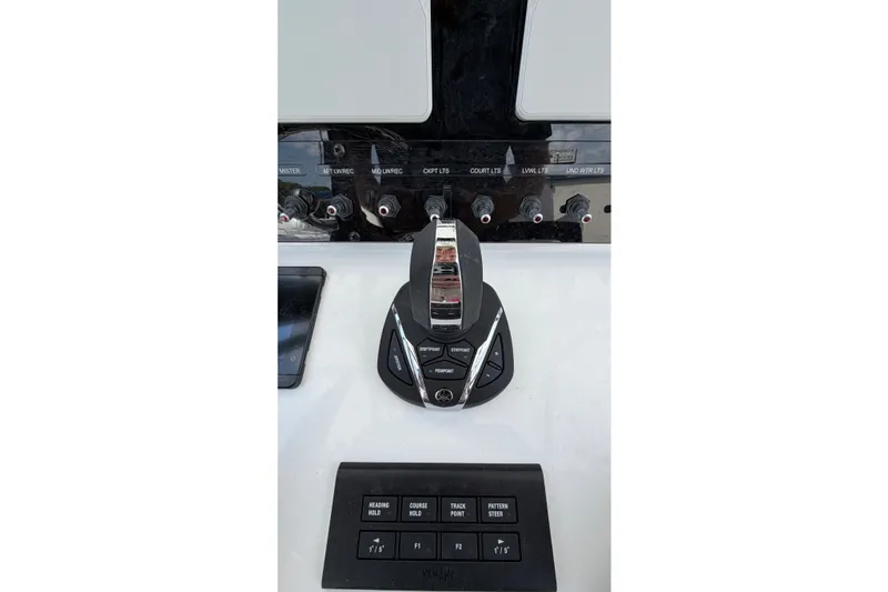 Slide: The Image of Control panel of 2027 Sea Hunt Gamefish 25 boat with switches and throttle. - 14