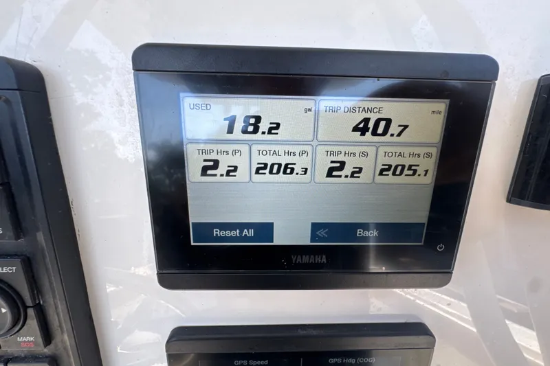 Slide: The Image of Yamaha display showing fuel usage and trip data on 2023 Key West 244 Center Console boat. - 6