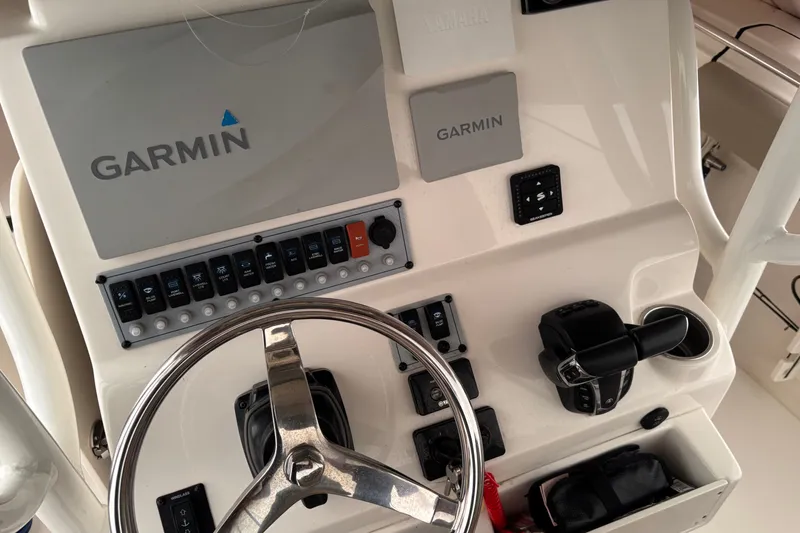 Slide: The Image of 2023 Key West 244 Center Console boat dashboard with Garmin navigation system. - 5