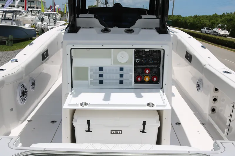 Slide: The Image of 2027 Sea Fox 288 Commander boat interior with control panel and Yeti cooler. - 13