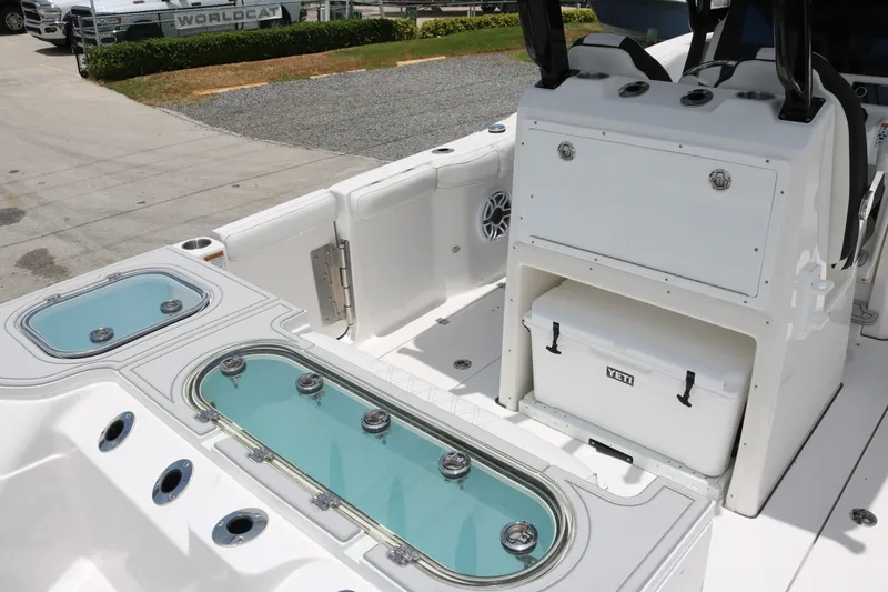 Slide: The Image of Interior view of 2027 Sea Fox 288 Commander boat, featuring storage and livewell compartments. - 18