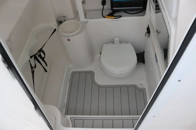 Slide: The Image of Interior of 2027 Sea Fox 288 Commander boat bathroom with toilet and storage. - 15