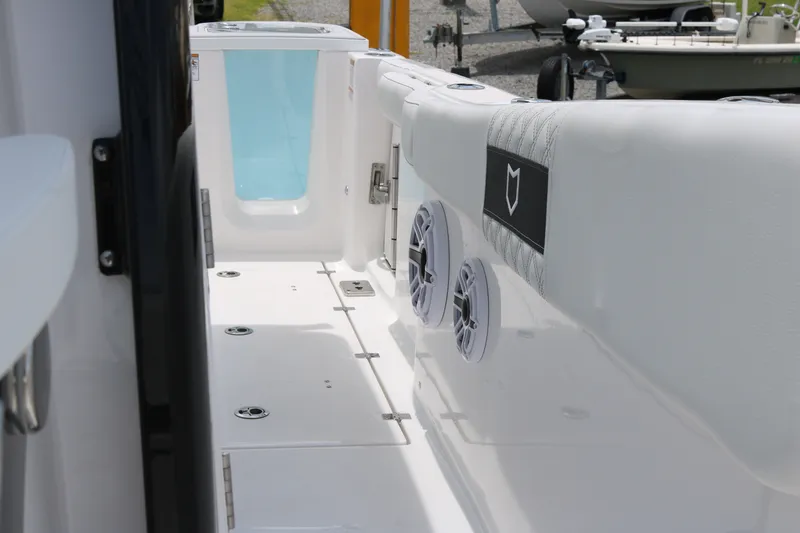 Slide: The Image of 2027 Sea Fox 288 Commander boat interior with speakers and storage compartments. - 16