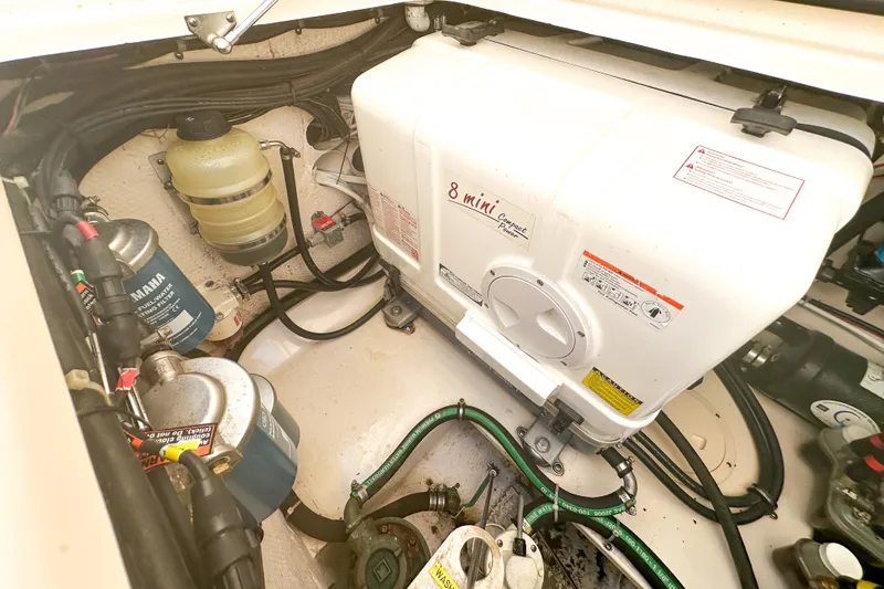 Slide: The Image of Engine compartment of a 2015 Grady-White Freedom 375 boat, featuring a compact power unit. - 50