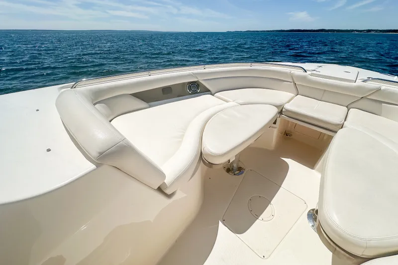 Slide: The Image of Luxurious seating on 2015 Grady-White Freedom 375 boat, overlooking serene ocean waters. - 30