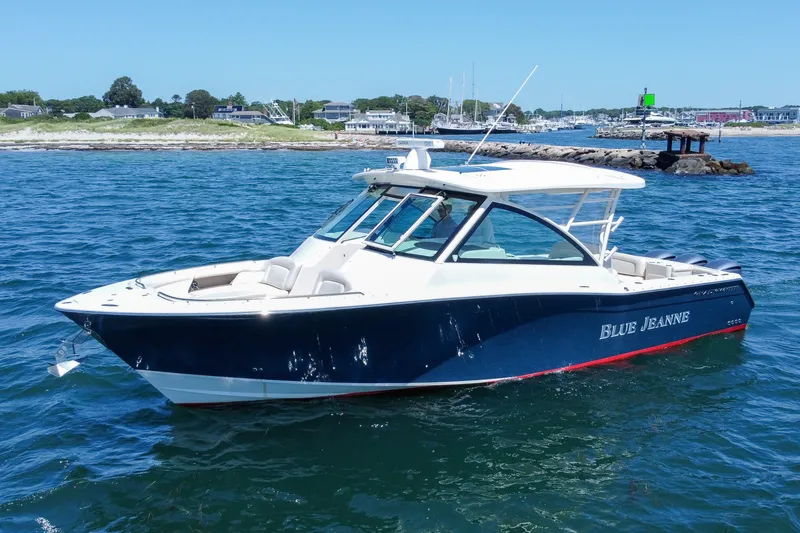 Slide: The Image of 2015 Grady-White Freedom 375 boat on water near shoreline. - 4