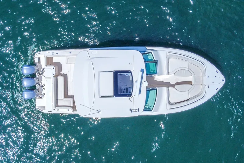 Slide: The Image of Aerial view of 2015 Grady-White Freedom 375 boat on blue water. - 58