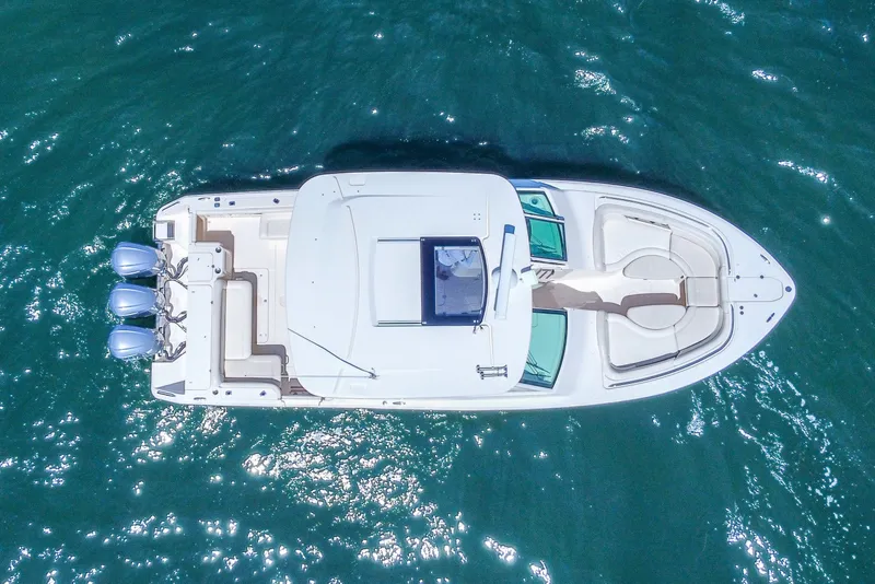 Slide: The Image of Aerial view of 2015 Grady-White Freedom 375 boat on blue water. - 57